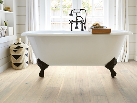 Bathroom with wood-look luxury vinyl flooring from Perge Carpet & Floors in Wheaton, MD